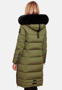 Long, olive-green puffer coat with a large black faux fur collar, zippered side pockets, and horizontal quilted design.