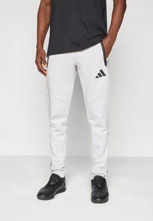 TIRO TRAVEL PANTS - Pantalon de survêtement - team light grey