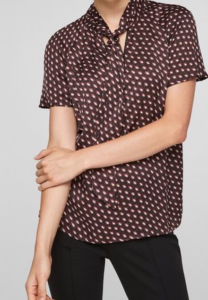 Kurzärmlige Bluse aus dunklem Stoff, mit einem mehrfarbigen Blattmuster, detailverliebtem Knotenkragen und einer lockeren Passform.