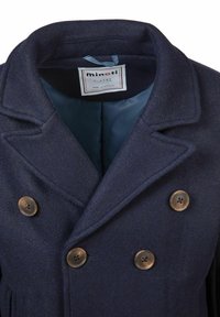 Tumedast sinisest villast kauboi jakk topeltkrõpsuga, kahe suurte pruunide nupuga ja siledalt vooderdatud sisepinnaga. Silt on nähtav seest.