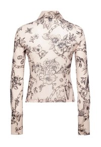 Let skjorte med lange ærmer i cremefarve med sort blomstret og sommerfugleprint. Har krave, tætsiddende design og knaplukning ved manchetterne.