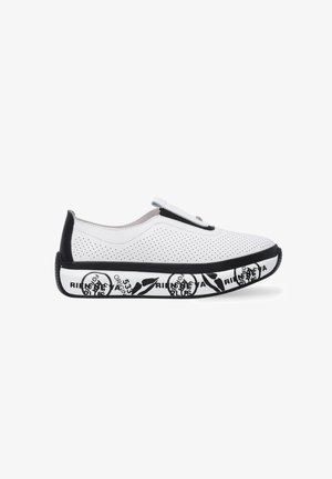 White perforated slip-on shoes with a black rubber sole featuring a printed design. The upper has a smooth finish and a subtle strap detail.