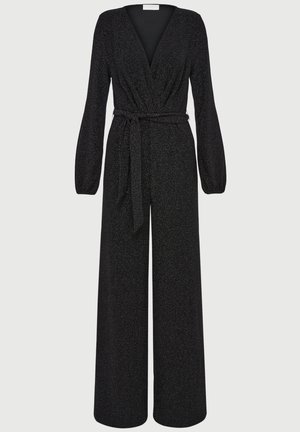 Black jumpsuit with a deep V-neck, long sleeves, cinched waist belt, and wide-leg design. Made of textured, shimmering fabric throughout.