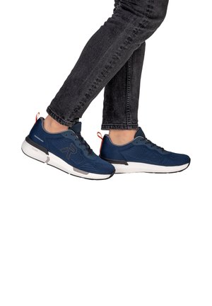 Navy blue athletic shoes with mesh fabric, white sole, and gray accents. Features a decorative red pull tab at the heel and lacing system.