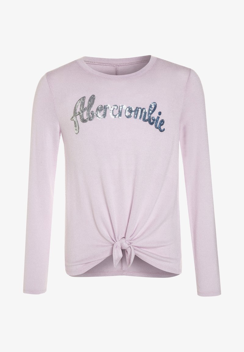 Chemise à manches longues en tricot rose clair avec un nœud à l'ourlet et le texte "Abercrombie" en sequins argentés sur la poitrine. Texture douce.