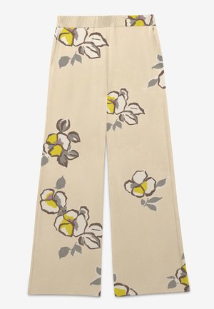 Beige weite Hose mit einem elastischen Bund und großen Blumenprints in Gelb, Grau und Braun, die über den Stoff verteilt sind.