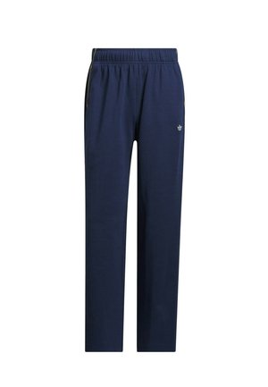 Pantalon de survêtement bleu marine en tissu doux, avec une taille élastique, des bandes latérales et un petit logo sur la partie inférieure gauche de la jambe.