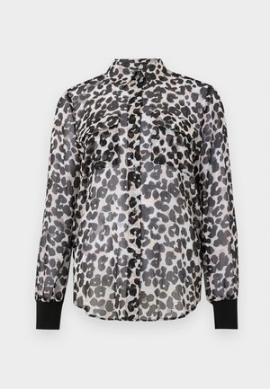Gjennomsiktig skjorte med knapper i leopardmønster i svart og grått. Har to frontlommer og svarte mansjetter ved ermene.