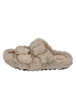 Furry beige slippers with two adjustable straps, soft texture, and a flat black sole. Features gold-tone hardware accents.