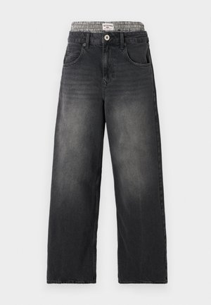 Black denim wide-leg jeans with a houndstooth patterned waistband. Features include front pockets and a button closure. Distressed texture.