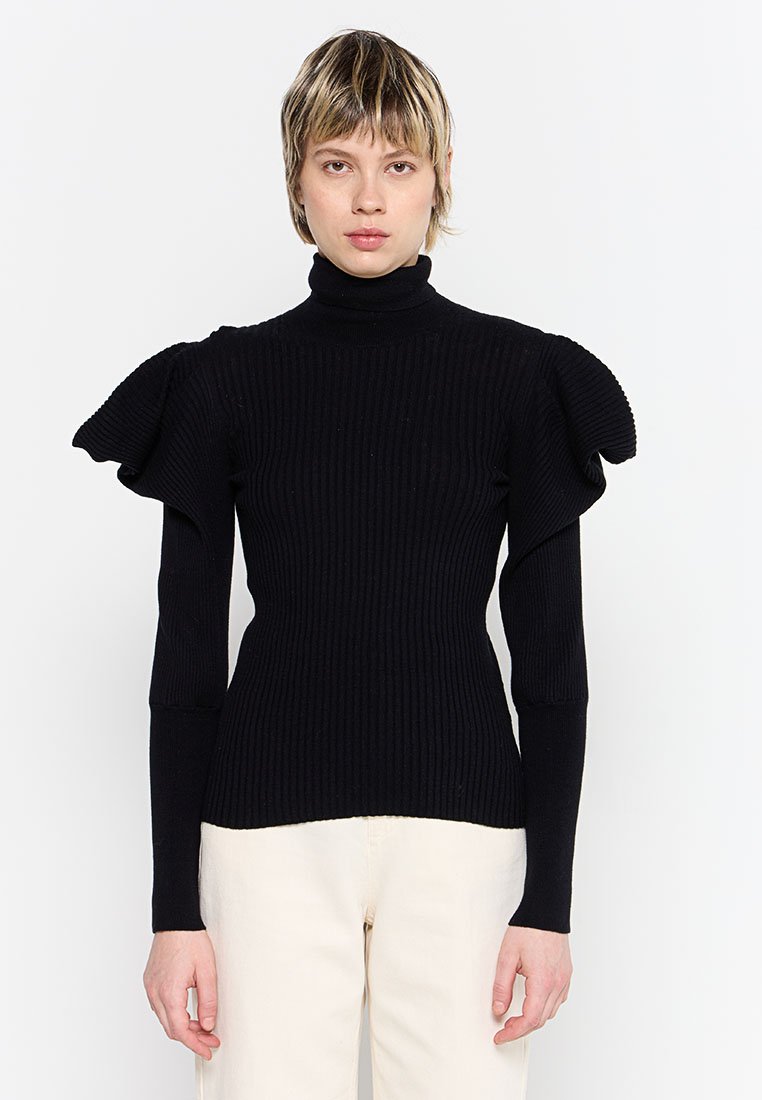 Pull à col roulé noir à côtes avec des manches bouffantes et une coupe ajustée. Fait en tissu tricoté texturé, avec des manches longues et fines.
