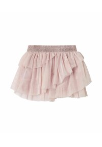 Jupe froncée rose clair faite de tulle superposé avec une taille élastiquée pailletée, présentant une texture douce et translucide ainsi qu'un design à volants.