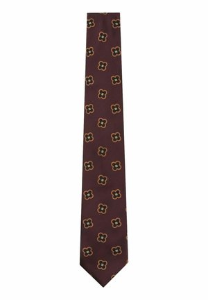 Brun slips med et gentaget mønster af små sorte og orange firbladede blomster, jævnt fordelt over stoffet.