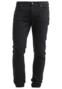 Jean noir slim avec poches avant, passants pour ceinture et fermeture par bouton, présenté sur fond blanc.