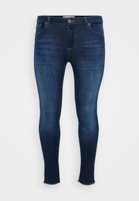 Dark blue skinny jeans in denim fabric, featuring a mid-rise waist, five-pocket design, and raw hem detailing at the ankles.