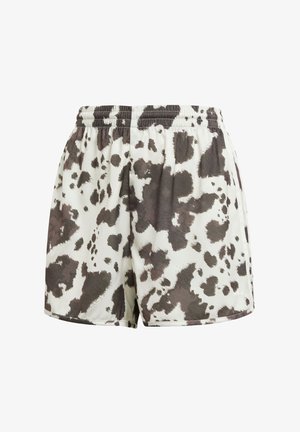 Drawstringshorts i krämfärg med ett brunt och svart nötkreaturmönster. Slät textur, lös passform, sydd fåll och elastisk midja.
