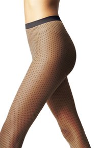 Calze trasparenti nudo con un motivo di piccoli punti neri, una finitura liscia e una vita nera solida. Aspetto aderente e texture.