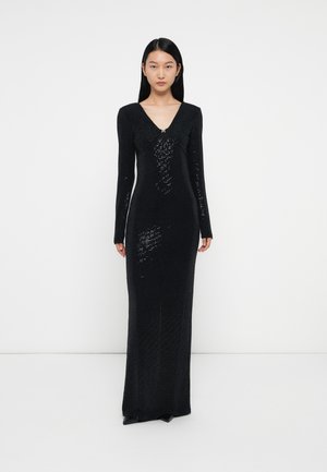 Black fitted dress with long sleeves, V-neckline, and sequin embellishments. Made of textured fabric, it features a floor-length silhouette.