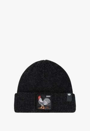 Zwarte gebreide beanie met ribbeltextuur en omgeslagen boord, voorzien van een geborduurd hanenpatch met het woord "COCK."