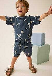 Next CHARACTER SET REGULAR FIT - Tracksuit bottoms - navy blue palms