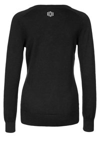 Svart stickad tröja med långa ärmar, ribbad muddar och nederkant, med ett geometriskt mönster av små prickar på den övre delen av ryggen.