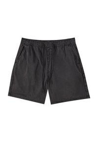 Shorts noirs en tissu léger. Dotés d'une ceinture élastique, d'un cordon de serrage et de deux poches latérales. Texture lisse, design simple.
