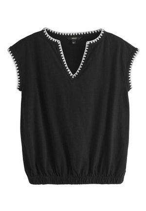 Schwarze Kurzarmbluse mit weißem Zickzackbesatz am V-Ausschnitt und an den Ärmelsäumen, elastischem Saum und weichem Stoff.