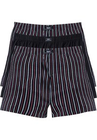 Boxer in un motivo a strisce con linee verticali nere, rosse e blu. Cintura elastica con etichetta del brand. Tessuto morbido.