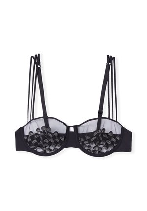 Black bra with sheer mesh cups and decorative black accents. Features multiple thin straps and a structured underwire design.