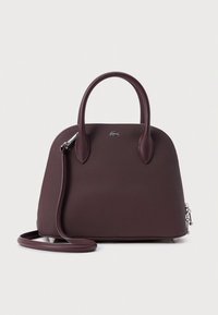 Dark brown textured leather handbag with dual top handles, detachable shoulder strap, silver logo near top center, and zip closure on the side.