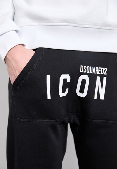 Sorte joggers med et slankt design, der har en hvid "ICON" print og DSQUARED2-logo på bagsmæk. Fremstillet af blødt, strækbart stof.