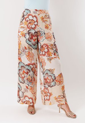 Pantaloni ampi floreali in beige con vivaci motivi blu, arancioni e marroni. Tessuto leggero con una vestibilità comoda e una cintura elastica.