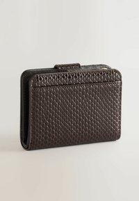 Brown textured wallet made of synthetic material, featuring a hexagonal pattern, a clasp closure, and a slim, rectangular shape.