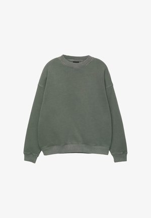 Groene crewneck sweatshirt gemaakt van zachte stof. Oversized pasvorm met ribgebreide manchetten en onderrand, met een gladde textuur en zonder patronen.