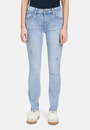 Lyseblå skinny jeans med en falmet vask, subtile slidte detaljer og distressed elementer. Designet med en mellem høj talje og fem lommer.