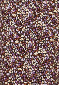 Black fabric with a colorful floral pattern featuring white, purple, and orange flowers. The design includes various shapes and textures.