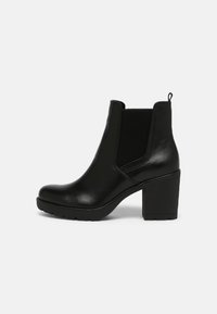 Black leather ankle boot with a rounded toe, textured elastic side panels, and a chunky block heel. Features a pull tab at the back.