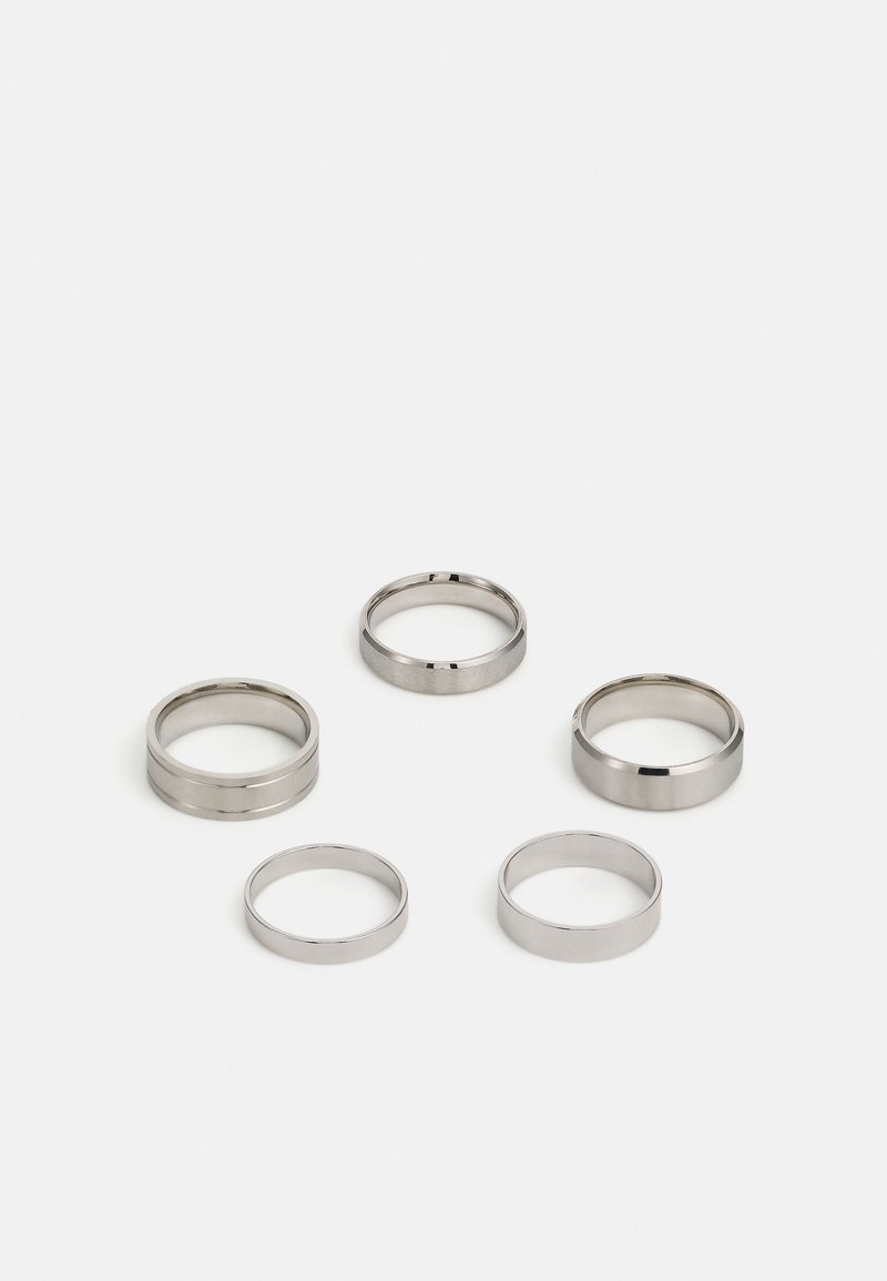 Set of five metallic rings in varying widths. The rings feature a smooth, polished surface and a consistent silver color.