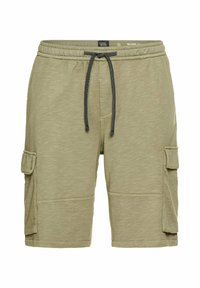 Cargo shorts i lys olivengrøn, lavet af blødt stof. Har to sidetasker, elastisk talje og snøre med sorte accenter.