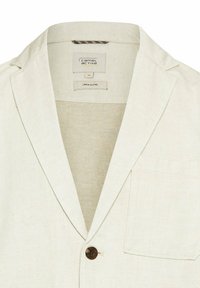 Marynarka z mieszanki lnu w kolorze off-white, z klapami o ryzowanym wykończeniu, pojedynczym zapięciem na guzik oraz kieszenią na piersi. Teksturowany materiał z subtelnymi wzorami.