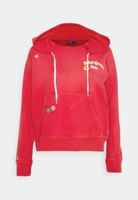 Červená mikina s kapucí, přední kapsou na zip, stahovací šňůrkou a vyšívanými detaily včetně květin. Jemná textura a žebrované manžety.