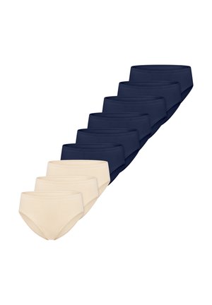 Zes marineblauwe en drie beige damesslips diagonaal gerangschikt op een witte achtergrond.