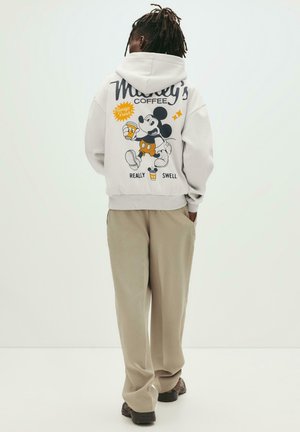 Light gray hoodie featuring a cartoon design of Mickey Mouse holding a coffee cup, with colored accents and text below. Casual fit with a hood.