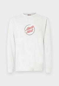 Bijela majica s dugim rukavima od pamuka, središnji crveni grafički prikaz "Santa Cruz" okružen crnim dizajnom bodljikave žice.