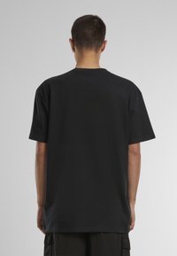 Mister Tee OVERSIZE - Nyomott mintás póló - black