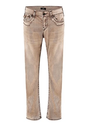 Jean slim délavé marron clair avec poches avant, passants de ceinture, fermeture par bouton et détails de coutures visibles.