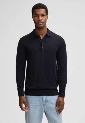 Navy long-sleeve polo shirt made of soft fabric with a collared neck, three-button placket, and ribbed cuffs and hem.