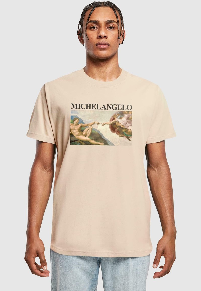 Beige cotton t-shirt featuring a graphic print of Michelangelo's artwork. Round neck, short sleeves, and relaxed fit.