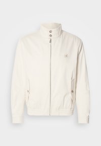White lightweight jacket with a high collar, front zip closure, two side pockets, and elastic cuffs. Features a logo on the left chest.