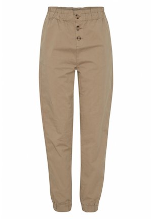 Beige tapered bukser laget av bomull. Har elastisk midje, tre frontknapper og elastiske mansjetter for en tettsittende passform ved anklene.